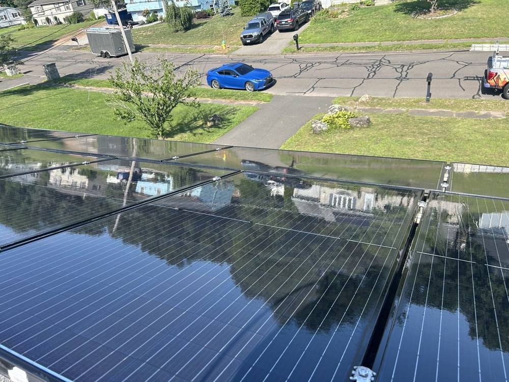 Cleaned panels reflecting the sky, mirror finish