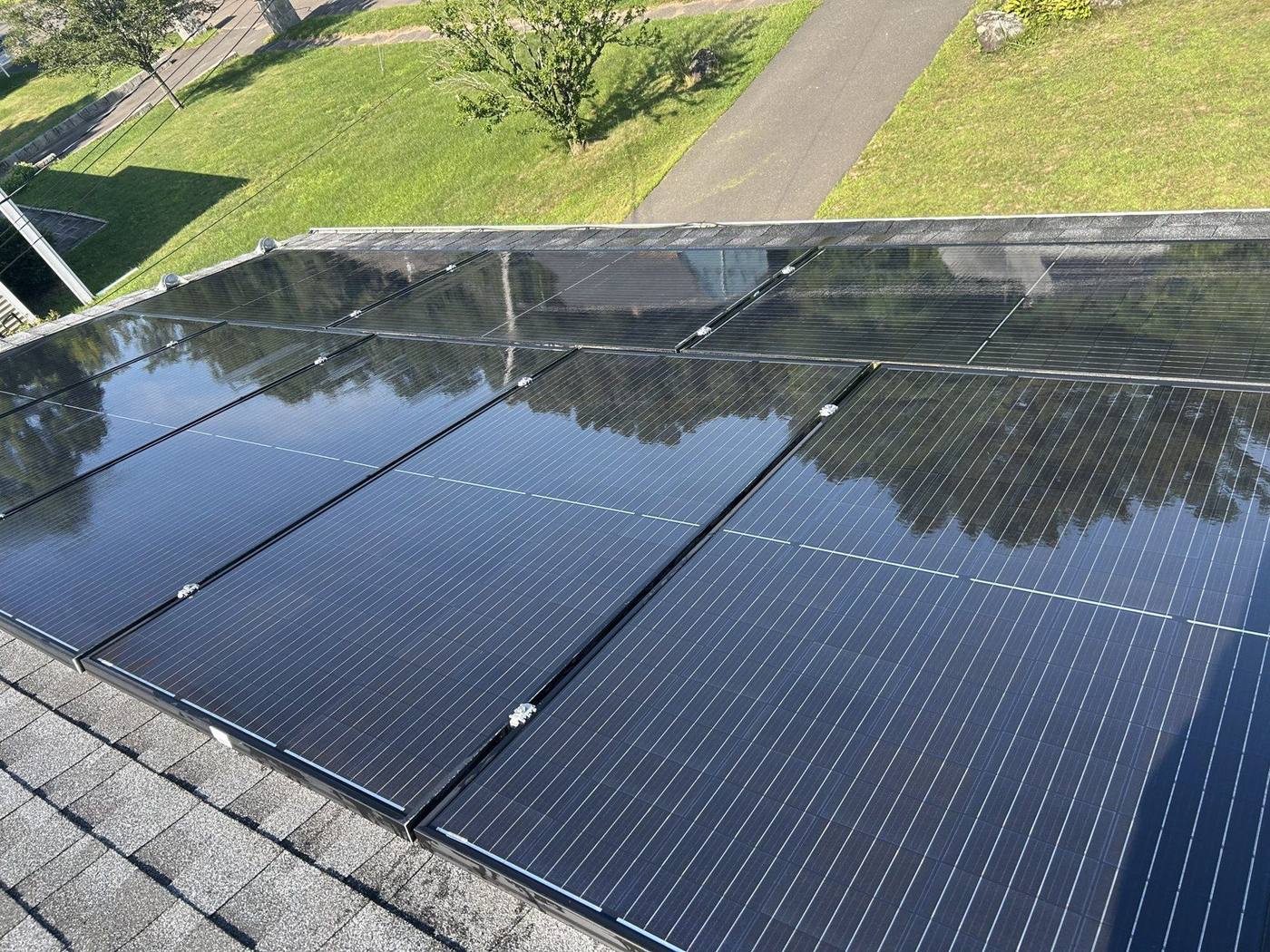 Freshly cleaned solar panels on a Connecticut home